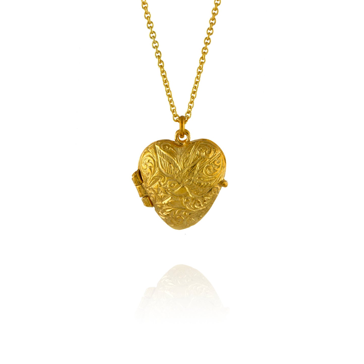 Gold heart-shaped locket on a chain against a white background