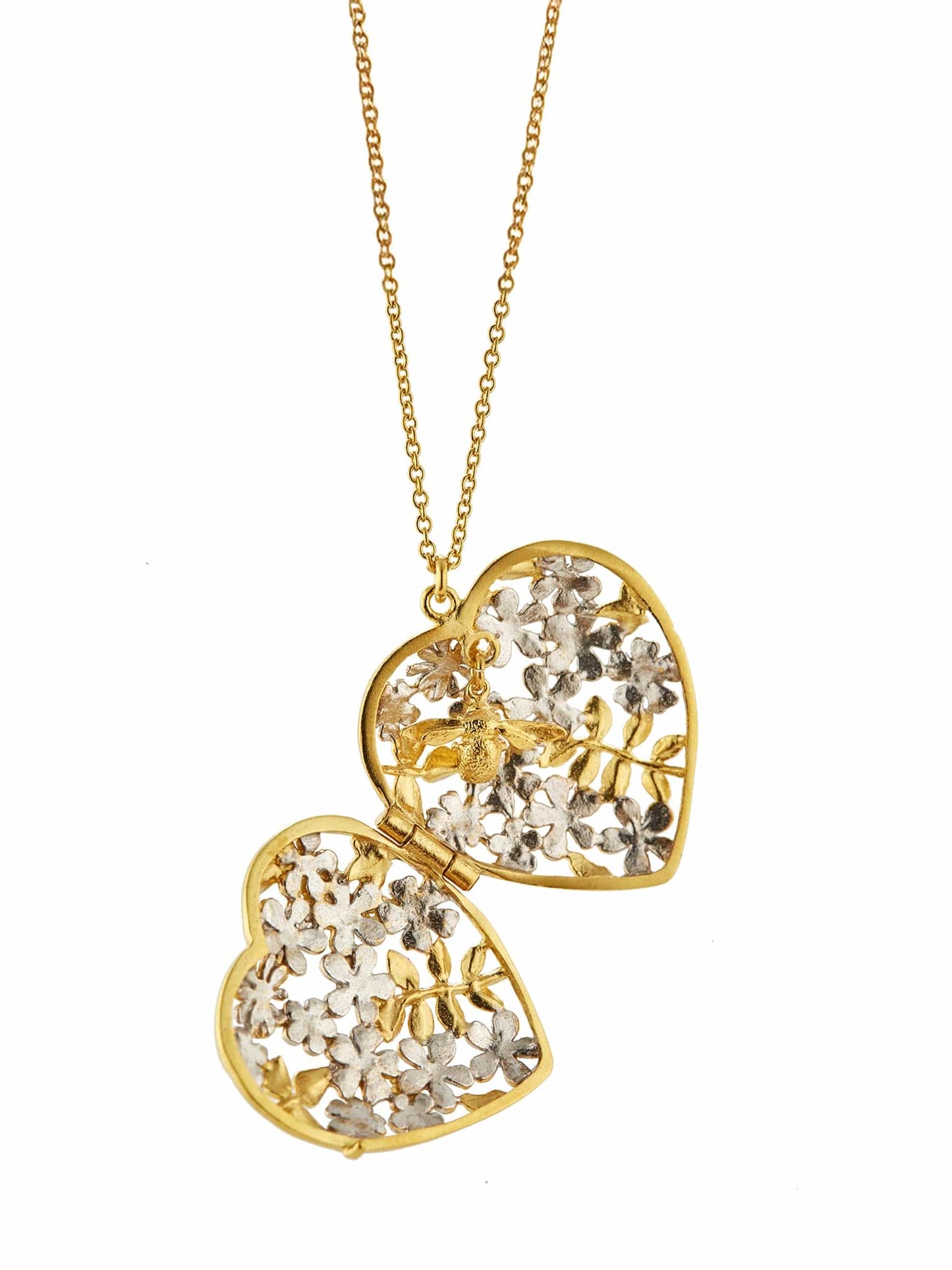 Open locket made from gold and silver with bee inside