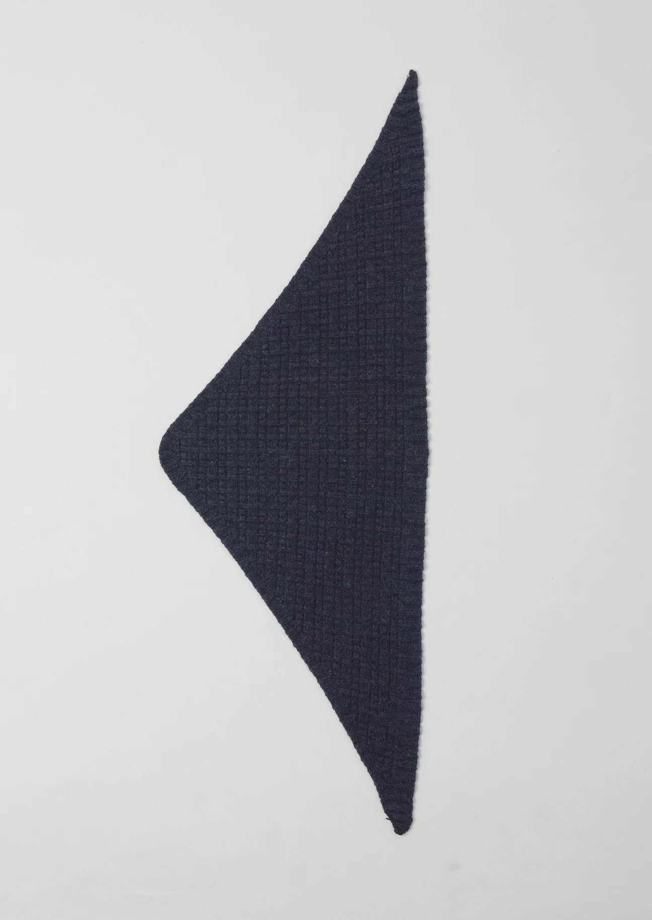 Navy blue triangular fabric on a light gray background