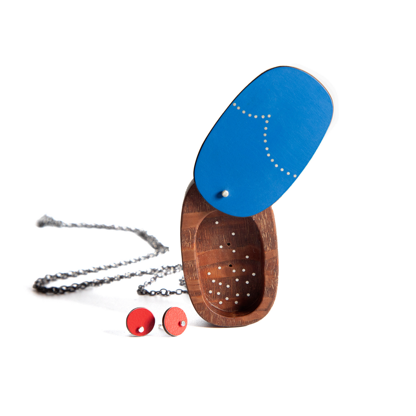 Wooden jewelry box with blue lid, necklace, and earrings on a white background