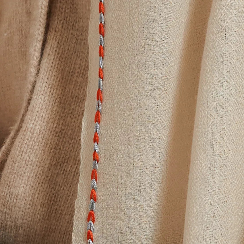 Detail of dust scarf with orange and sky border embroidery stitch
