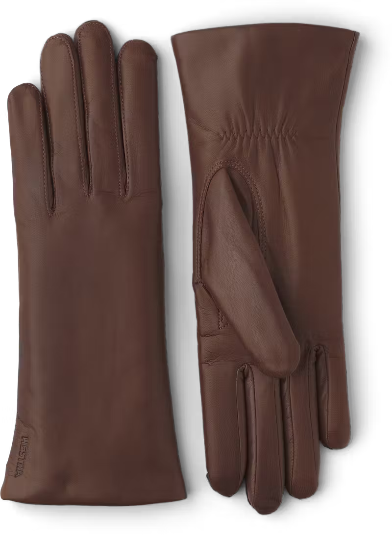 Pair of brown leather gloves on a white background