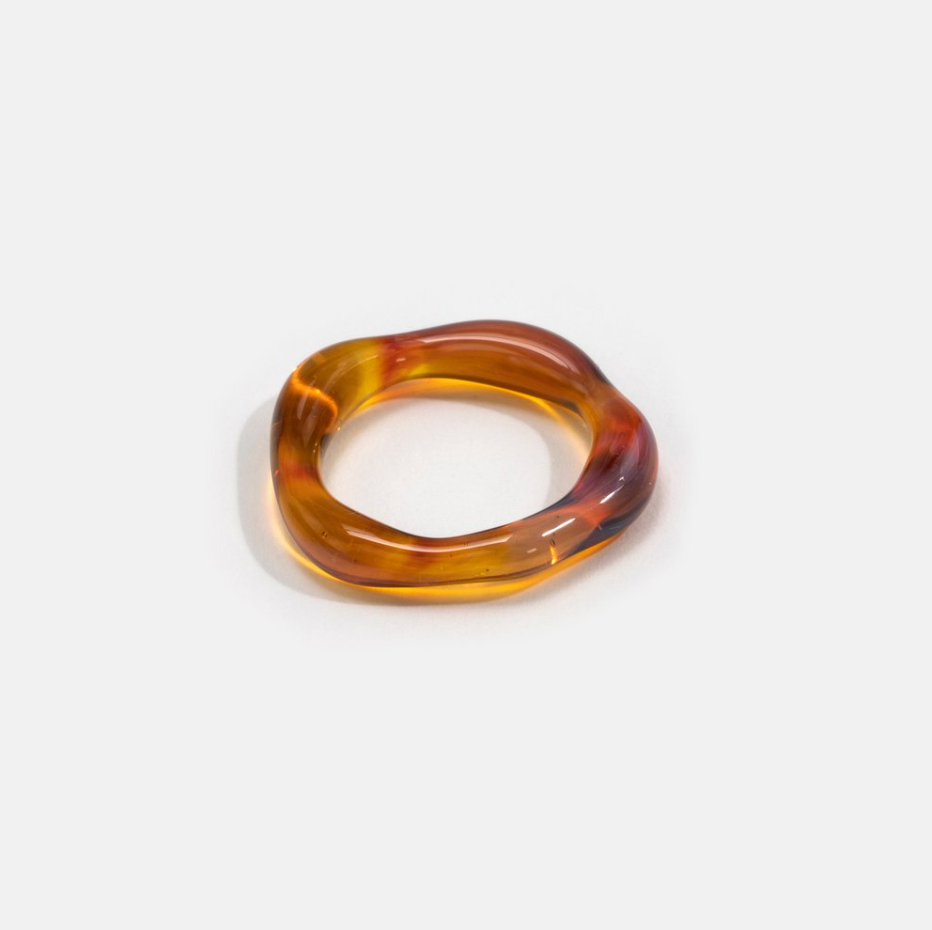 Round organic shaped glass ring in amber color