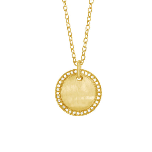 Gold necklace with a round pendant on a white background