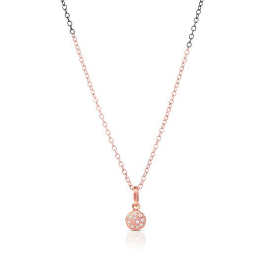 Rose gold necklace with a small round pendant on a white background