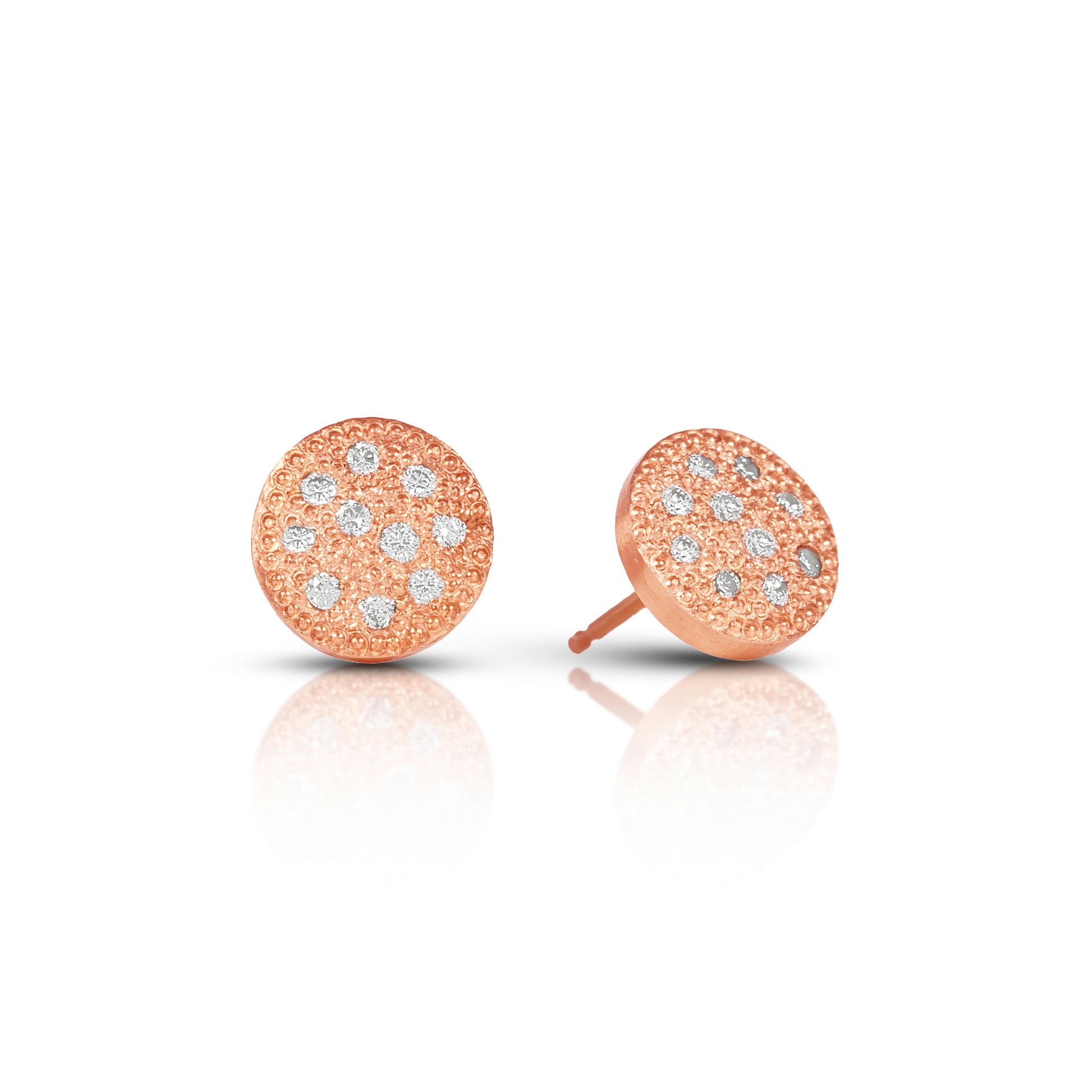 Rose gold earrings with diamond accents on a white background