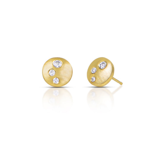 Gold earrings with embedded diamonds on a white background