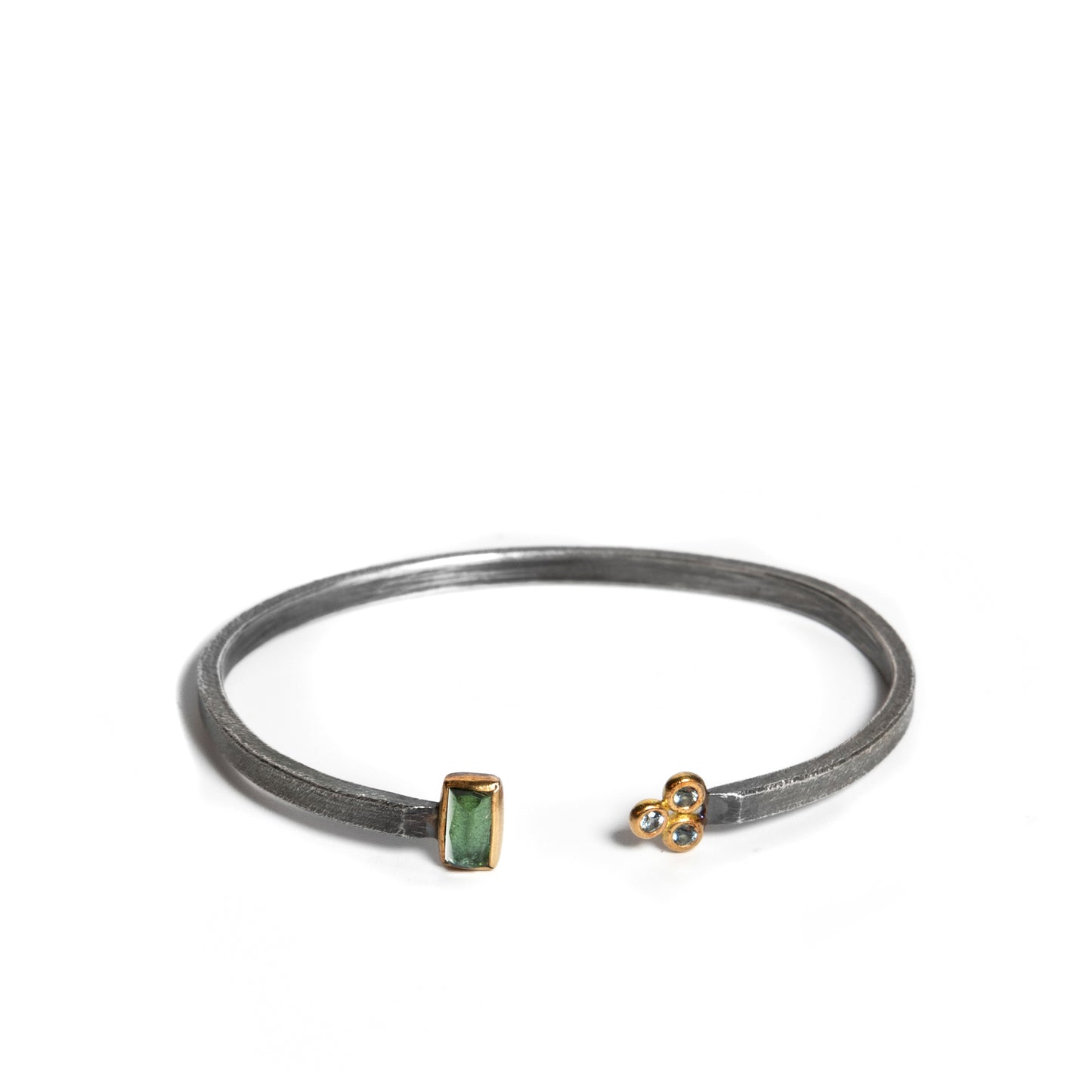 Oxidized silver cuff bracelet with green tourmaline and blue sapphires