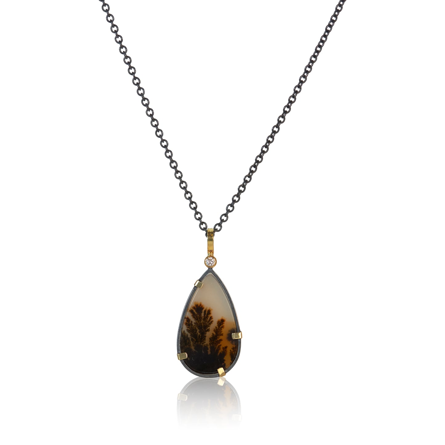 Image of a dendritic agate pear shaped pendant with a white diamond highlight on an oxidized sterling silver chain.