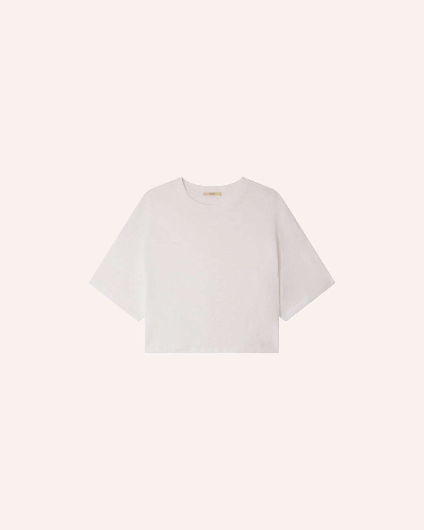 White t-shirt on a light beige background