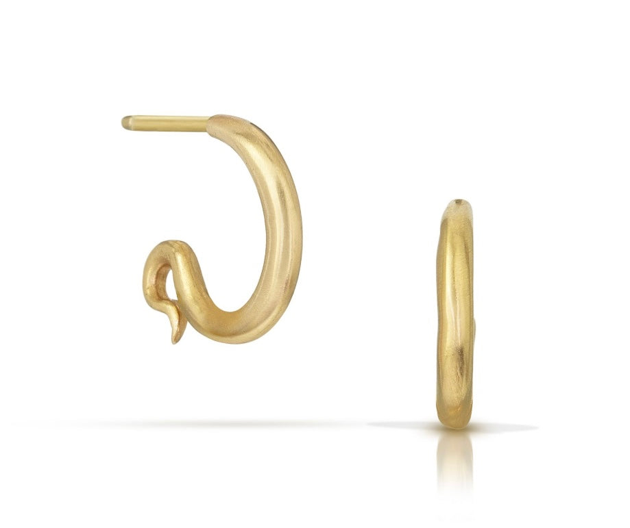 A pair of gold huggie hoop earrings, one shown from a side profile and the other from a front-facing profile, on a clean white background.