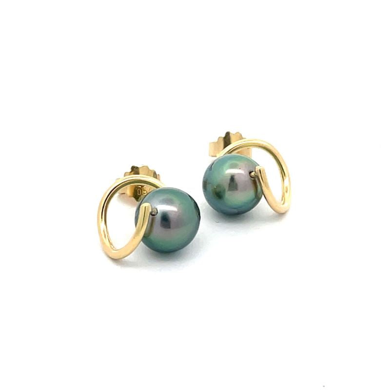 A pair of gold earrings with round, iridescent greenish-blue freshwater pearls, shown on a plain white background.