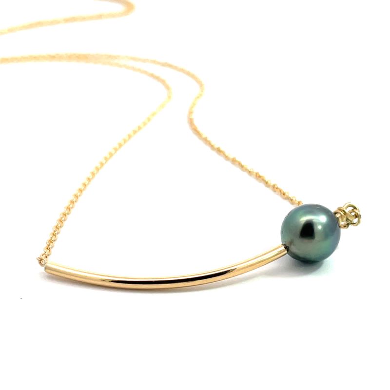 A curved yellow gold necklace with a dark green pearl.