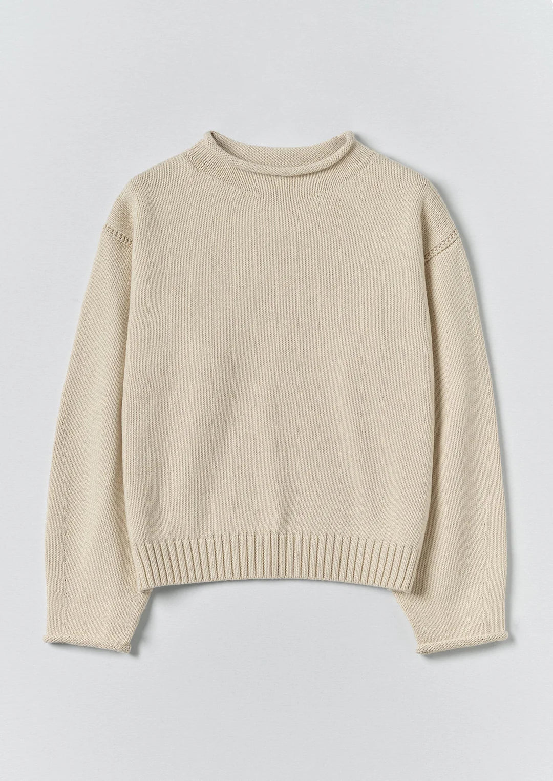 Beige sweater on a light gray background