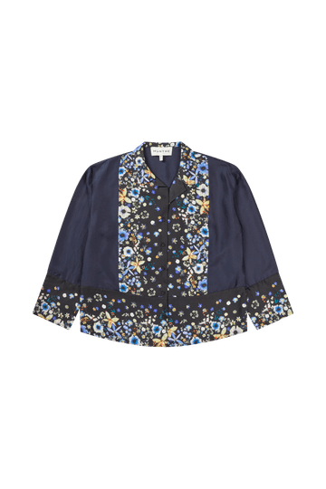 Navy blue long sleeved silk shirt with a floral pattern running down the center and the hem.