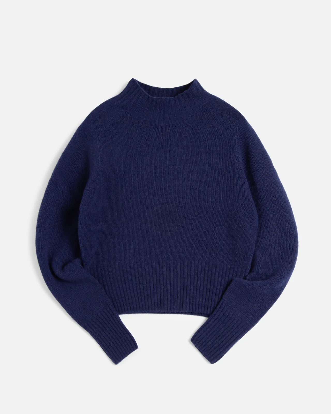 Navy blue sweater on a light gray background