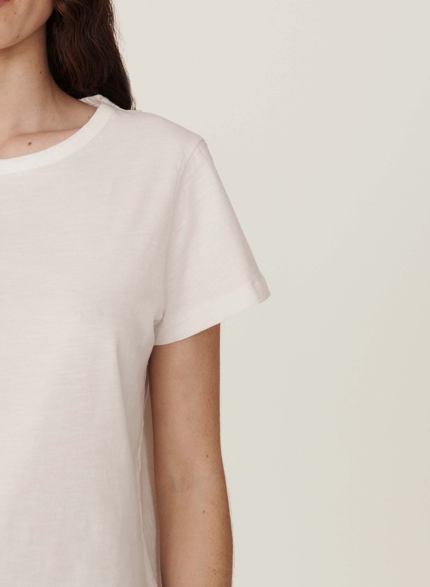 Detail view of one side and sleeve of T-shirt