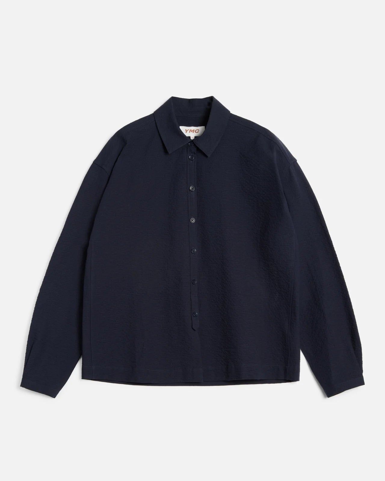 Navy blue shirt on a light gray background