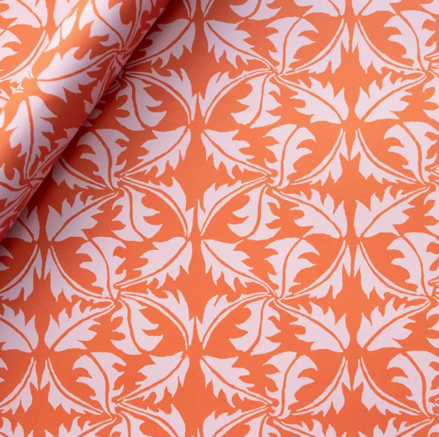 Gift wrap with dandelion leaf print in pink and orange
