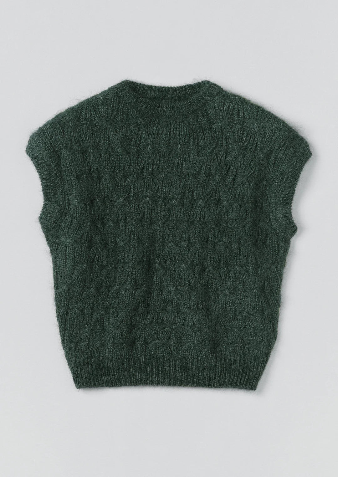 Green knitted vest on a light gray background