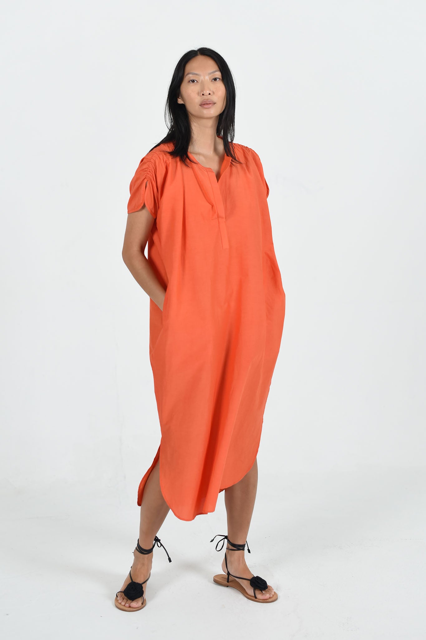 orange poppy color shirt dress on female model with long black hair wearing black sandals