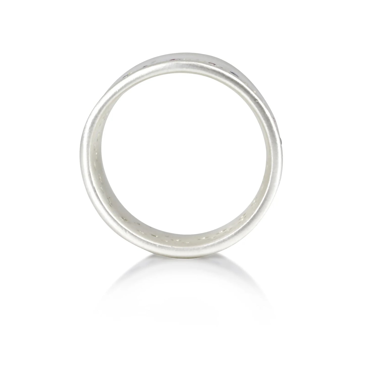 Side view of wide band silver ring