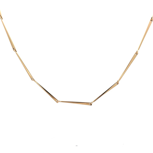 A gold bar link chain in 18k yellow gold on a white background.