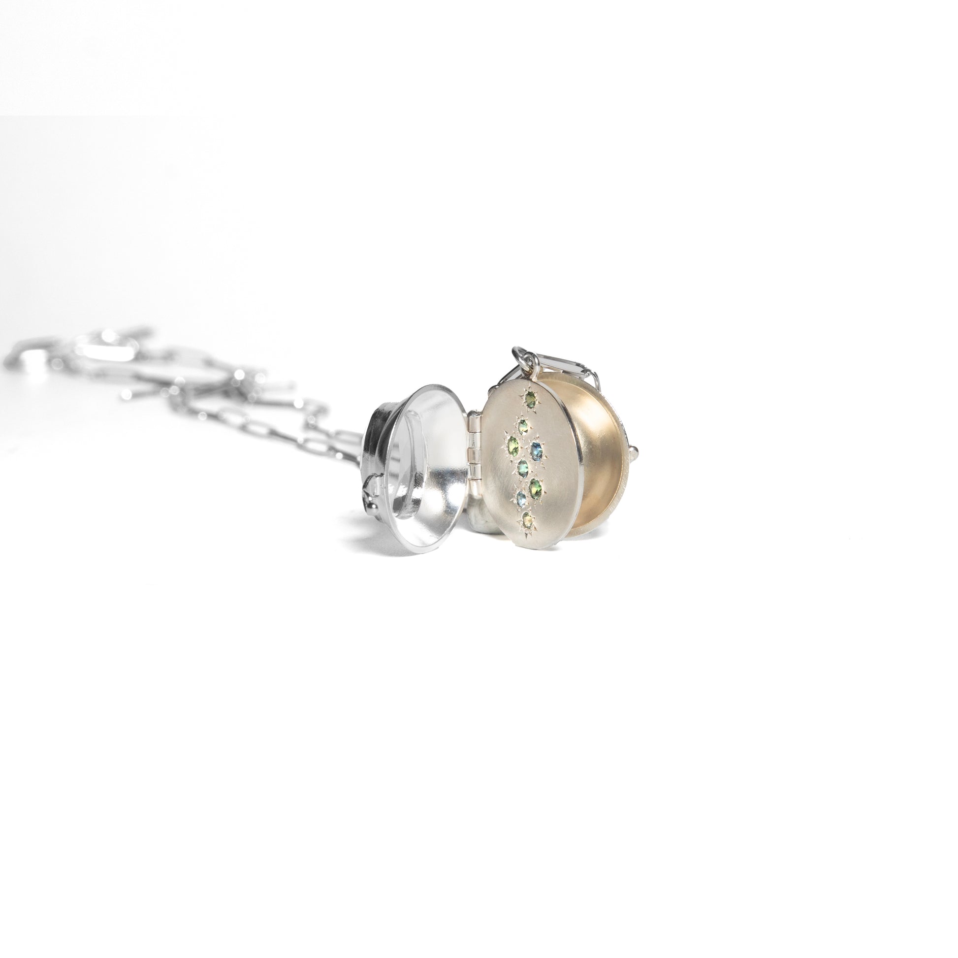 Silver and gold necklace with a pendant on a white background