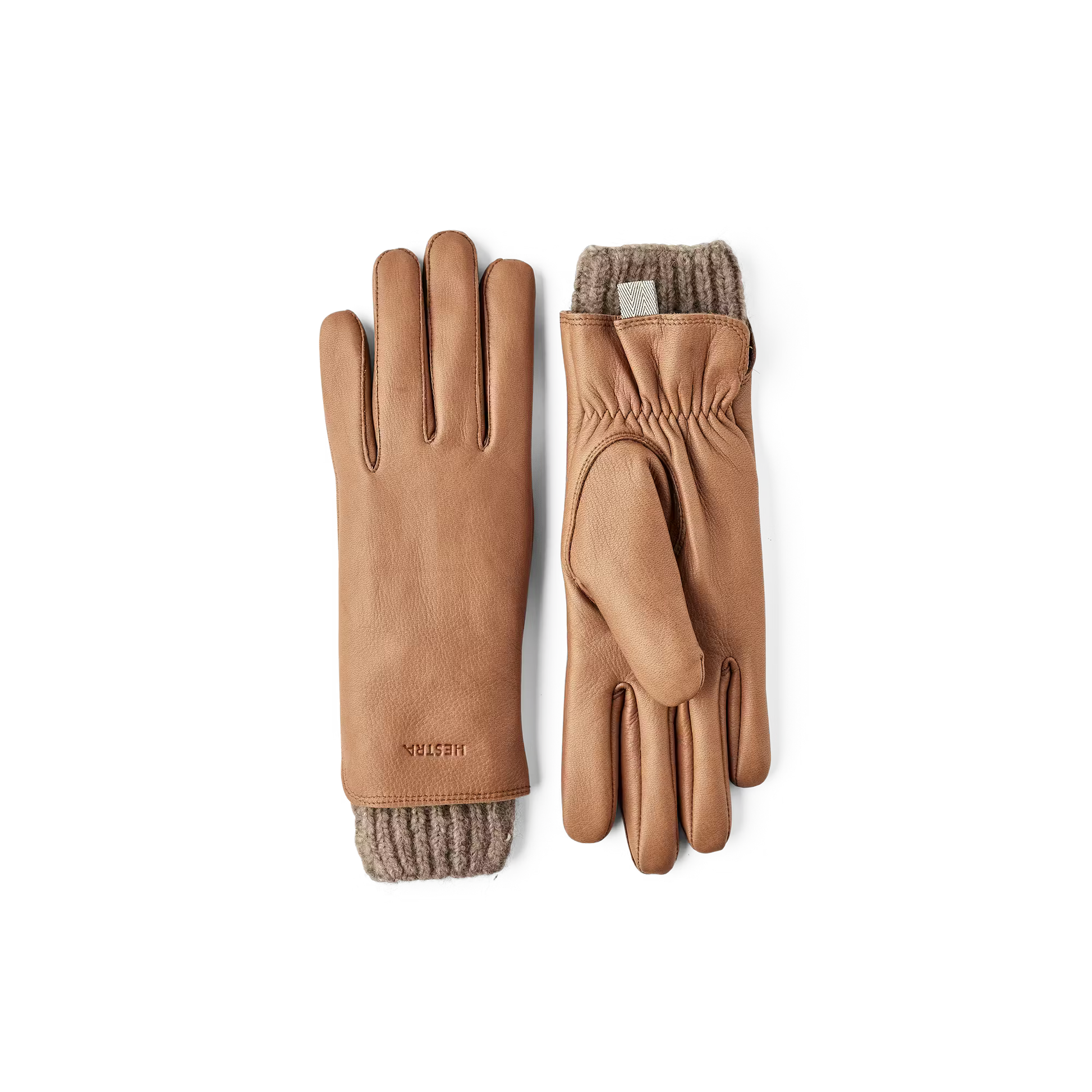 Pair of brown leather gloves with fur lining on a white background