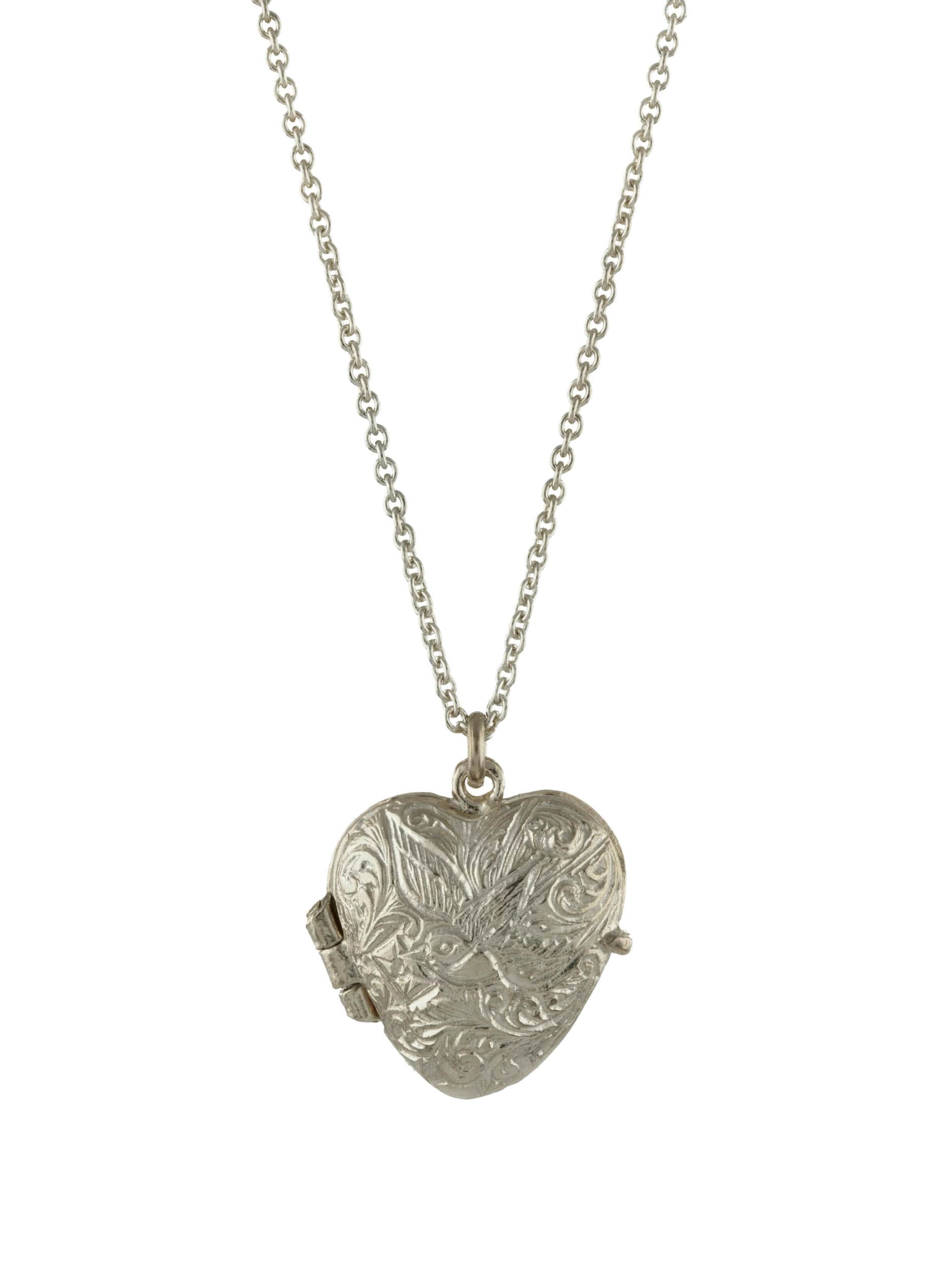 Silver heart-shaped locket on a chain against a white background