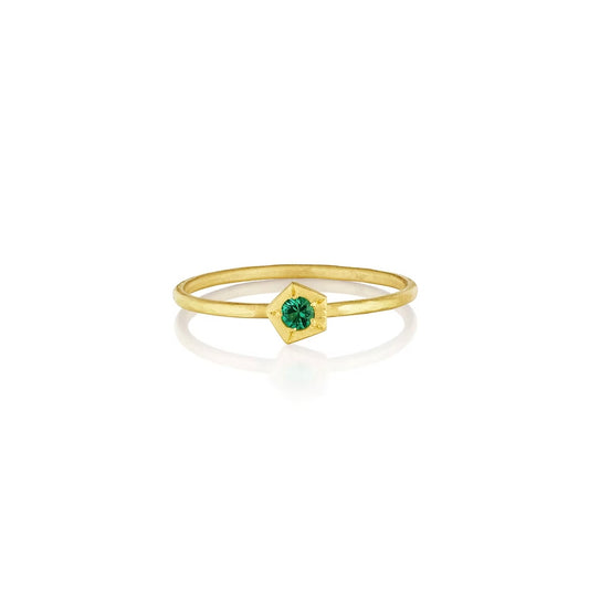 Think gold band with emerald set in gold hexagon shape