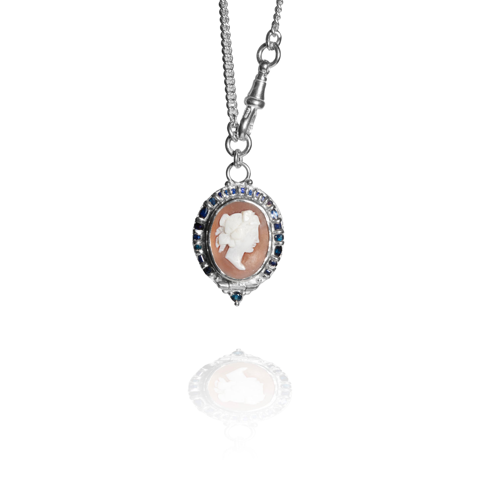 Silver necklace with a cameo pendant on a white background