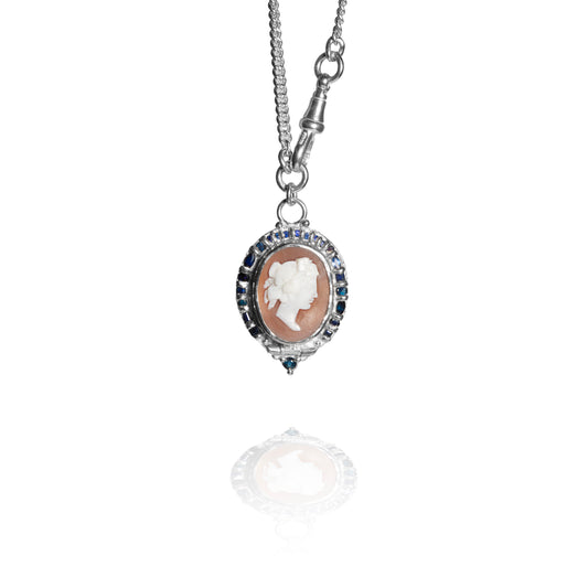 Silver necklace with a cameo pendant on a white background