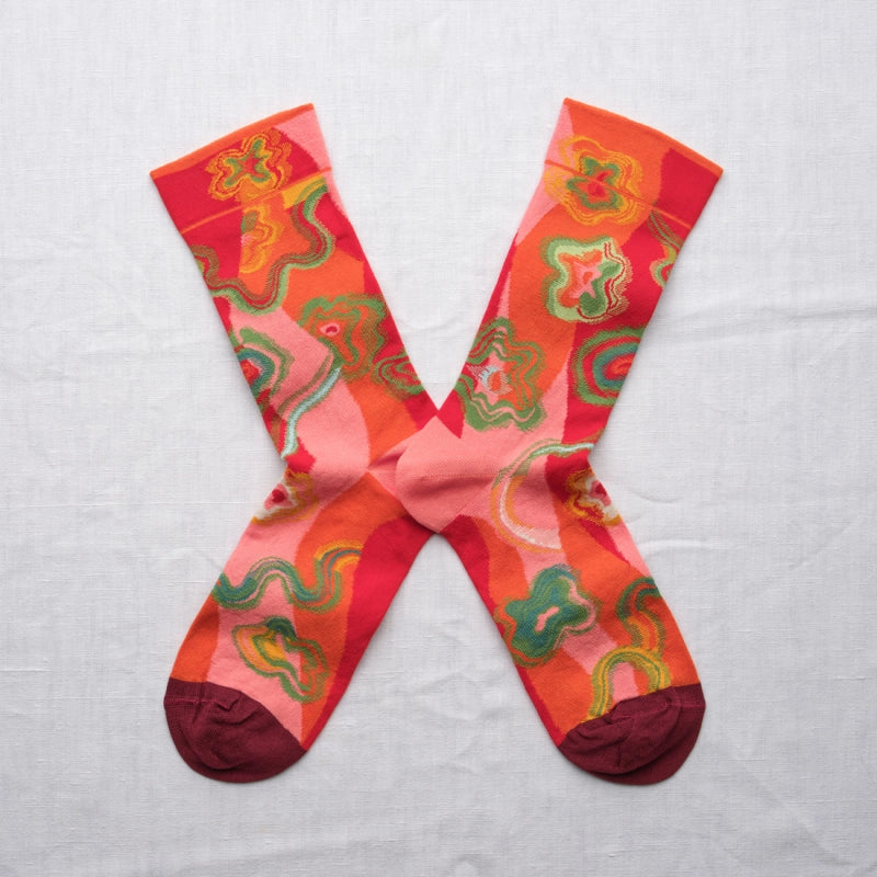 Colorful patterned socks on a light gray background