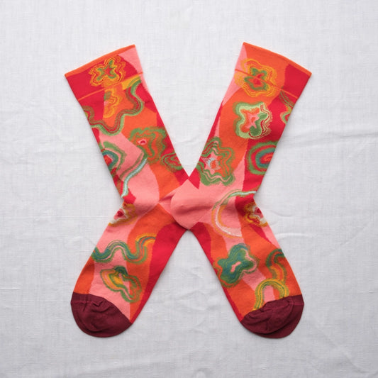 Colorful patterned socks on a light gray background