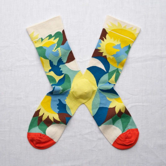 Colorful socks with a geometric pattern on a light gray background