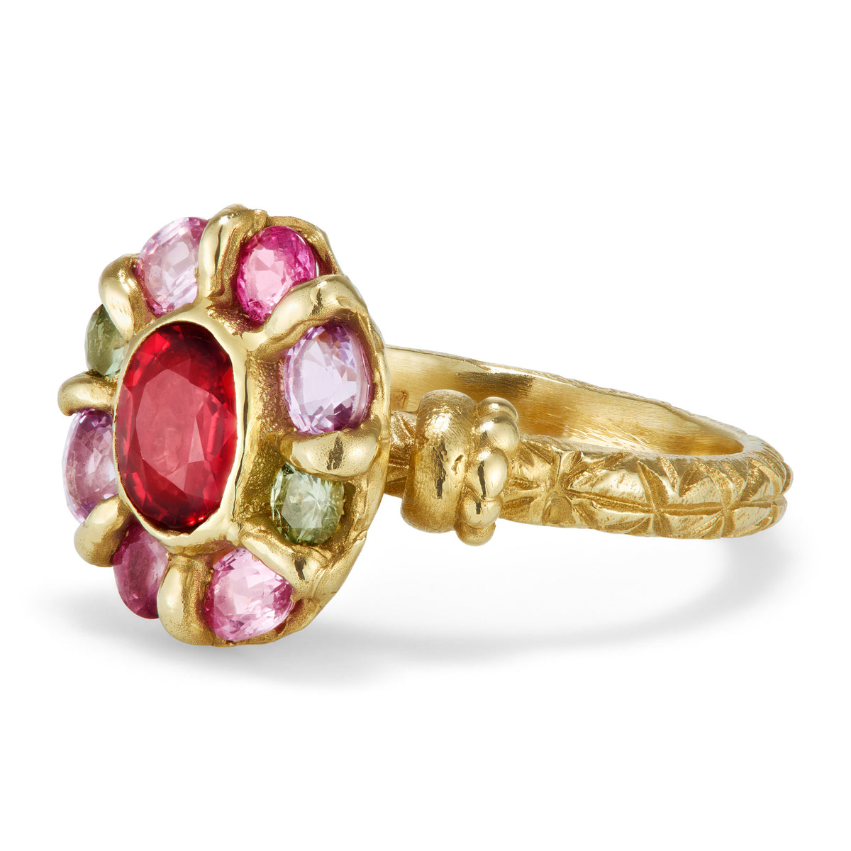 A red sapphire sits in the center of a yellow ring, surrounded by a circle of colored sapphires.