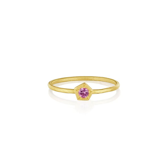 thin gold ring band with single pink sapphire