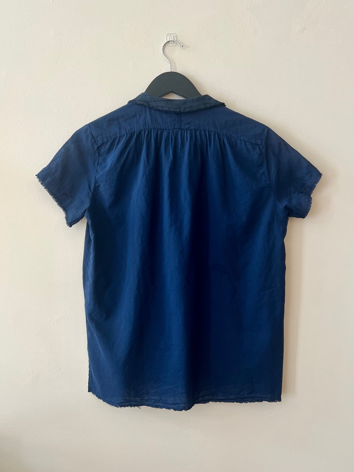 Reverse side of short sleeve blue cotton shirt 