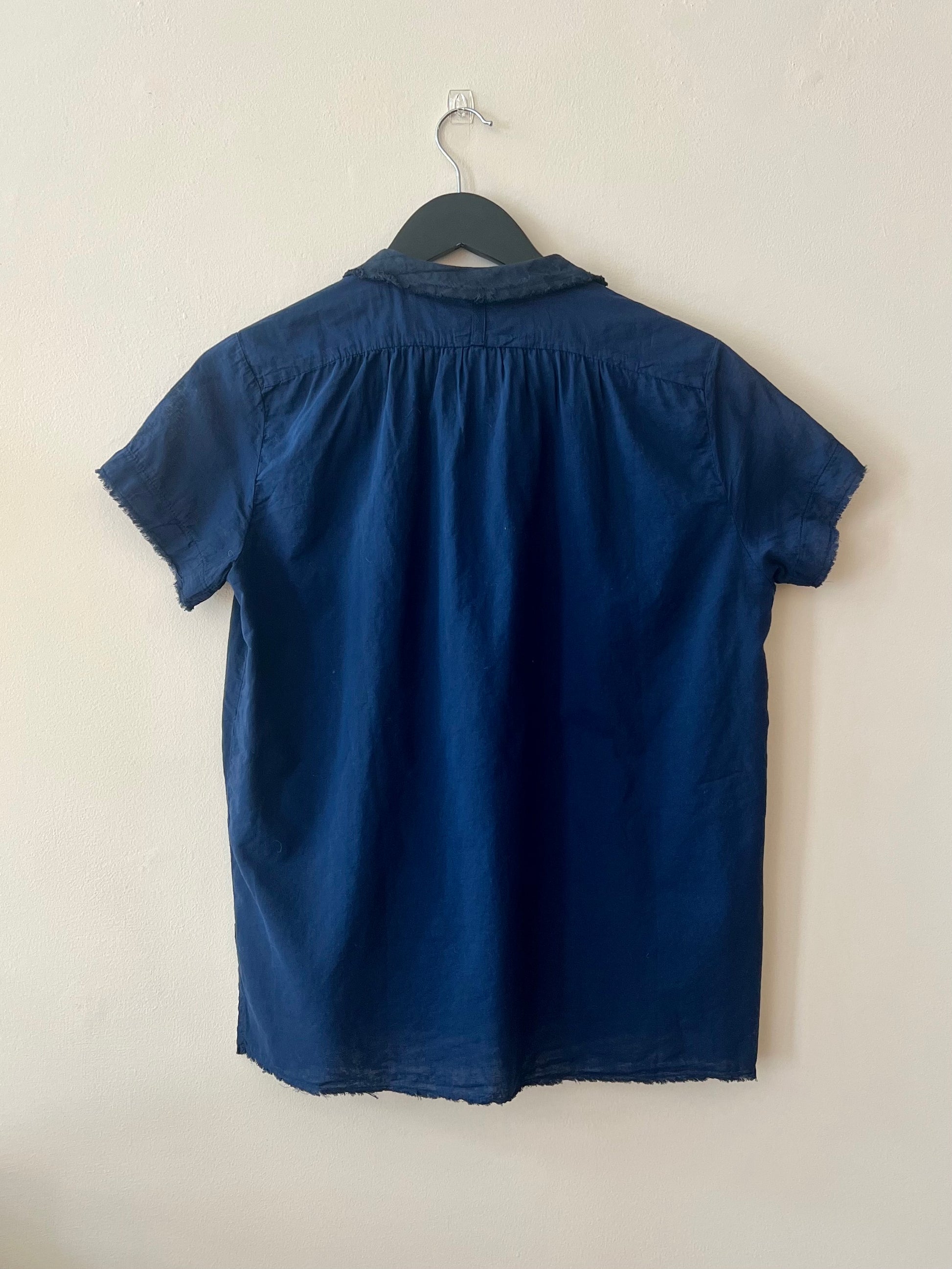 Reverse side of short sleeve blue cotton shirt 