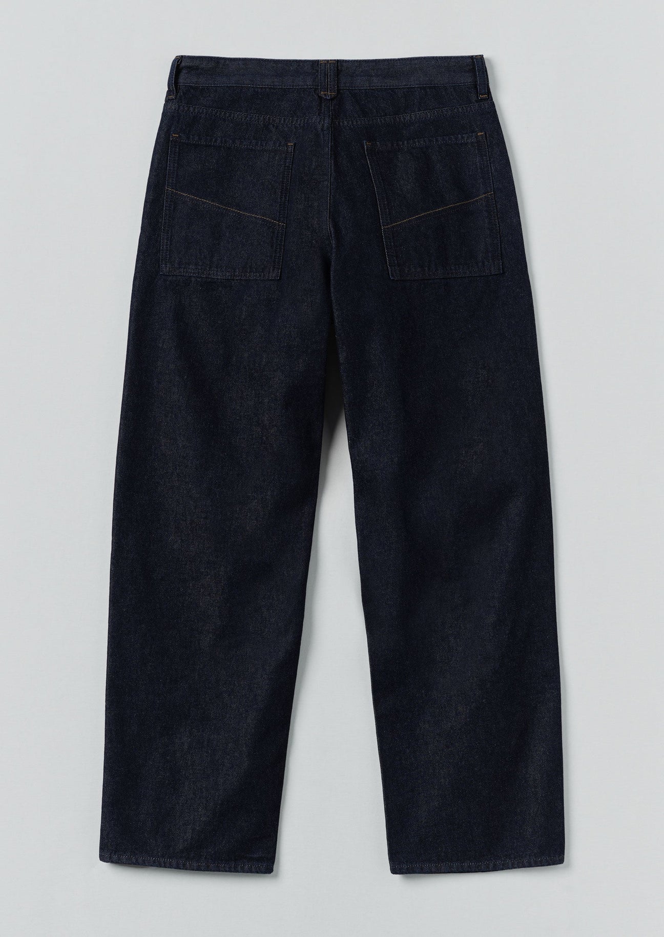 Dark blue jeans on a light gray background