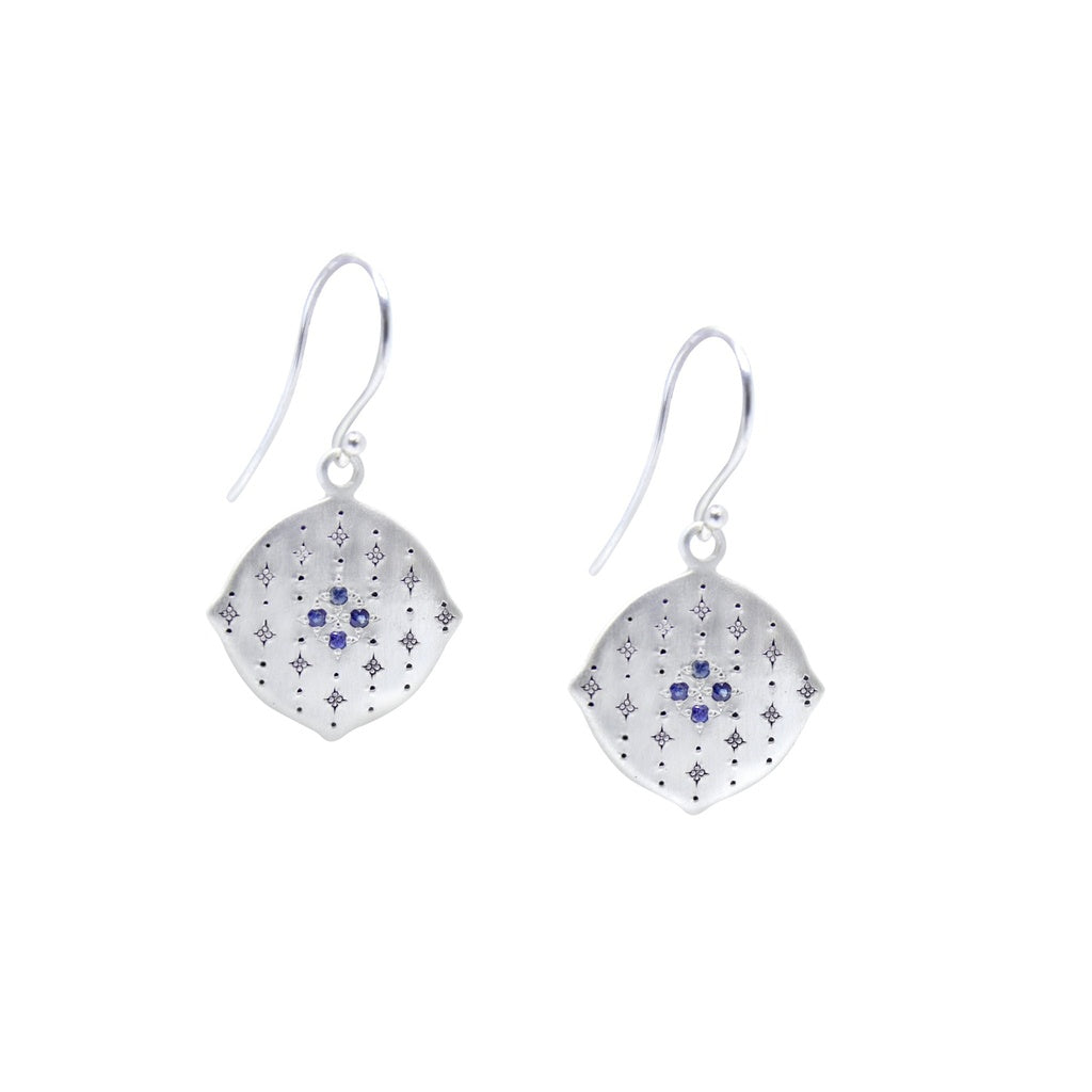 A pair of etched sterling silver dangle earrings with blue sapphires.