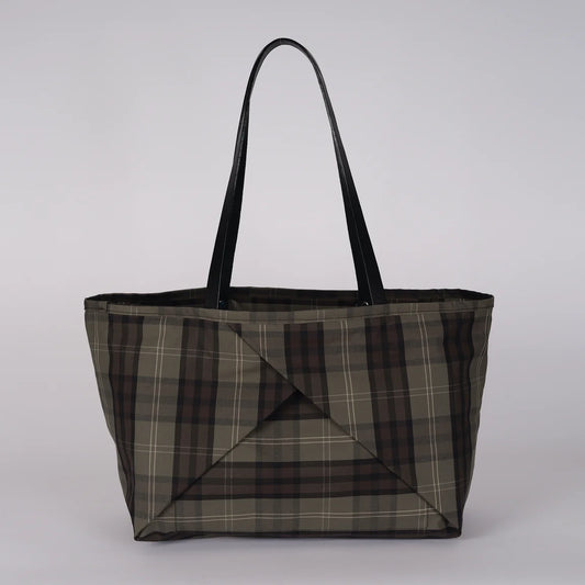 A large tote bag with a brown, gray, and black plaid pattern and black shoulder straps, shown against a plain white background.