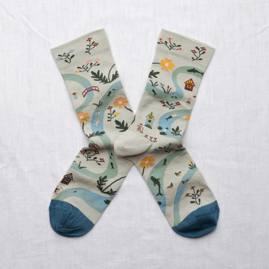 pair of socks with woodland trail motif