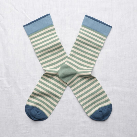 pair of green and white striped socks with blue toe and top detail 