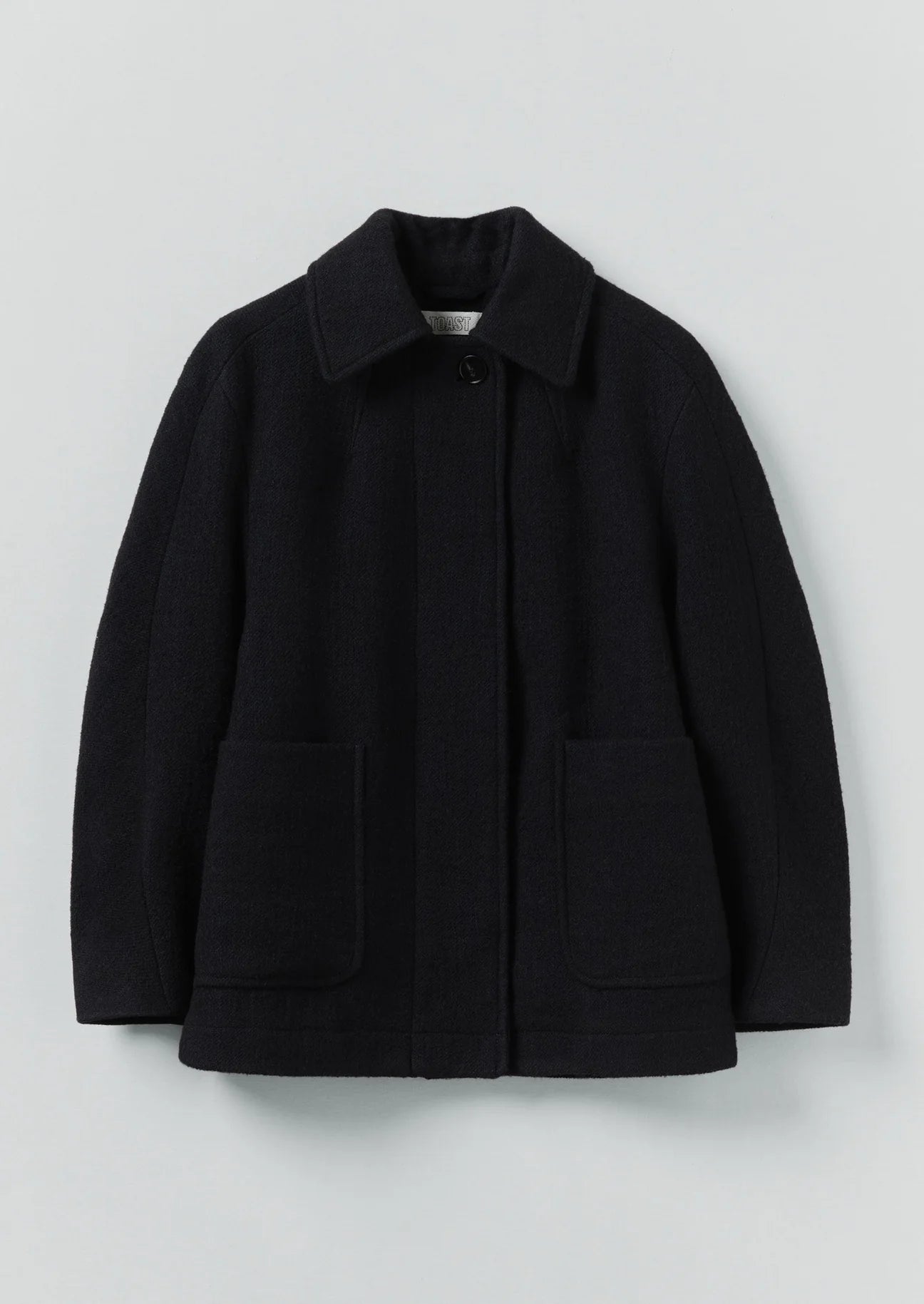 Black jacket with a collar on a light gray background
