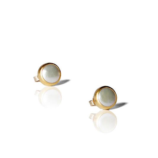 Small half cut white pearl post earrings.