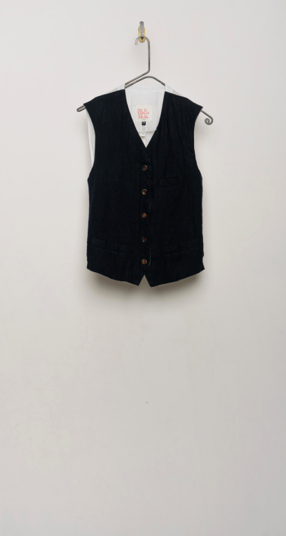 Navy vest shown flat on a hanger against a light background.