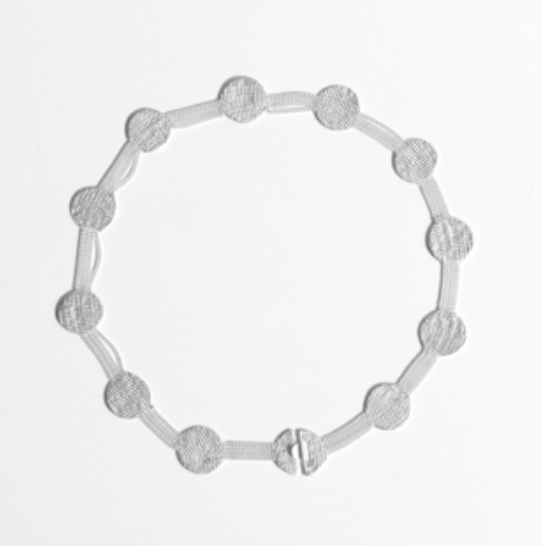 A silver-toned necklace with textured circular links and a matching clasp, displayed on a clean white background.