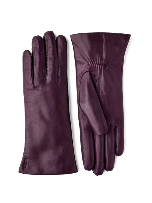 Pair of purple leather gloves on a transparent background